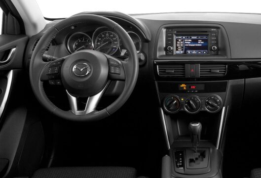 A car dashboard and steering wheel