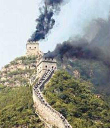 Smoke signal rising from a tower on the Great Wall of China