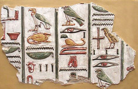Egyptian hieroglyphs carved and painted in stone, about 1,300 BCE