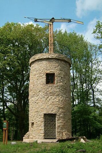 A stone optical telegraph tower with semaphore arms